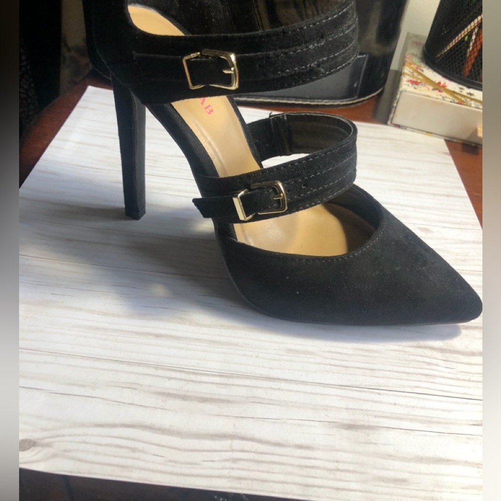 Black strappy heels 6 1/2. Never worn